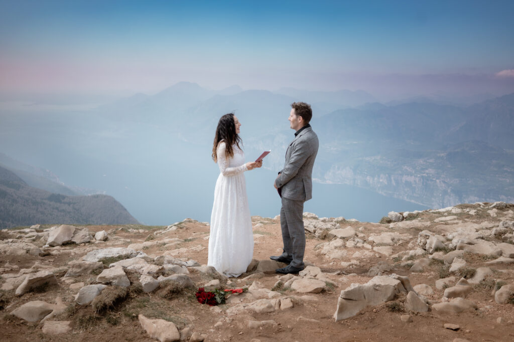 Malcesine elopement photography with cliffside Lake Garda views, castle paths, mountain scenery, and a quiet intimate wedding moment.