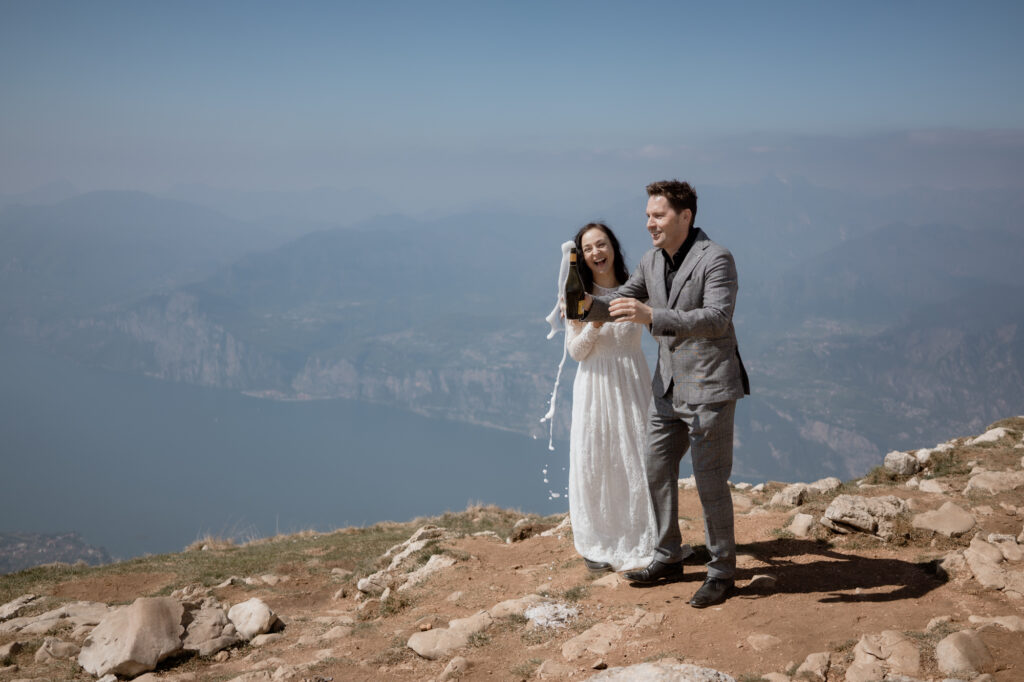 Couple celebrating after their vows on Monte Baldo during a Malcesine Lake Garda elopement