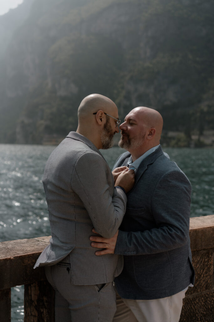 Gay couple embracing by Lake Garda during their Riva del Garda elopement