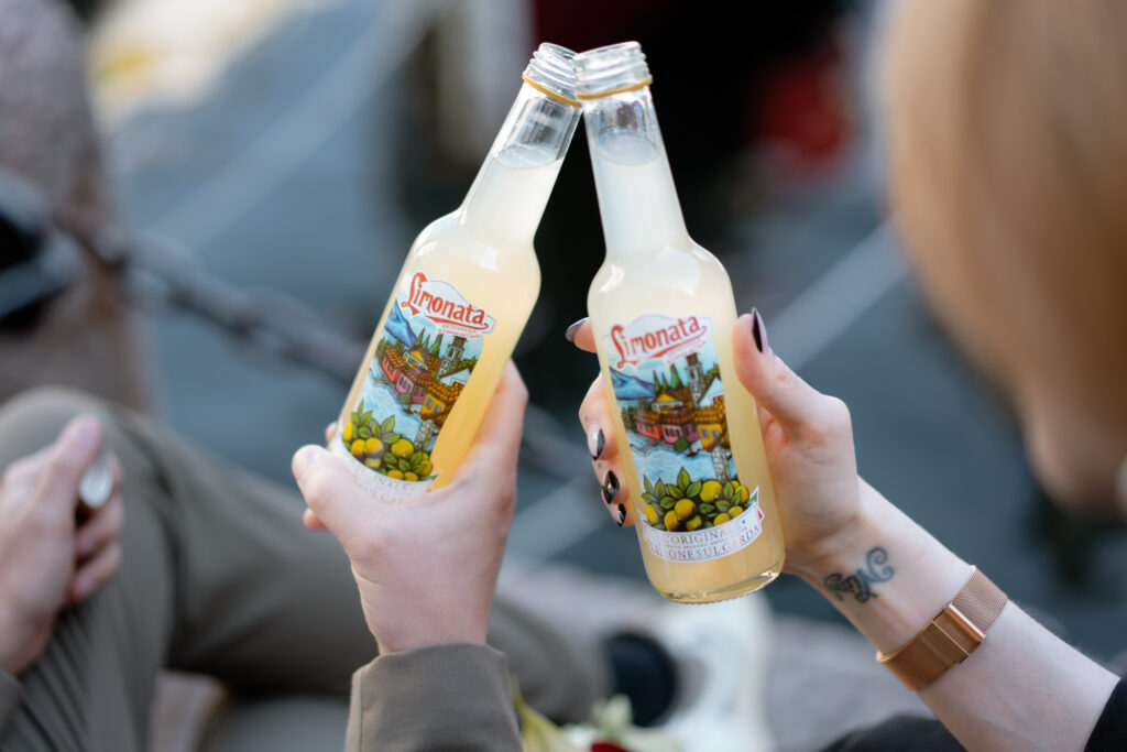 Couple toasting with limonata during their Limone del Garda elopement