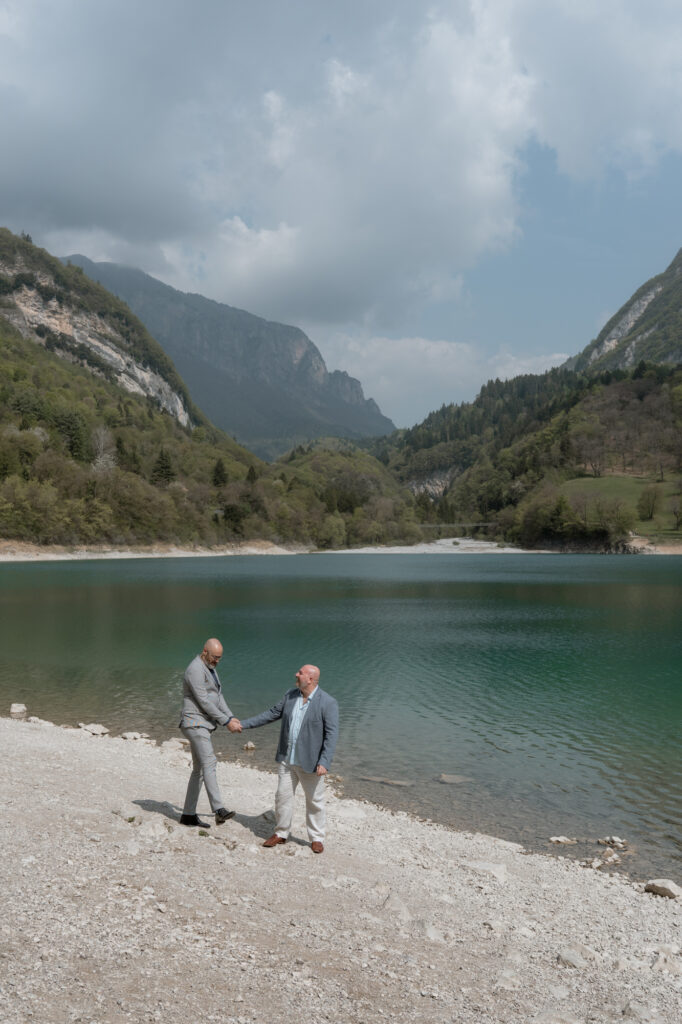 Couple walking together by Lake Tenno during their Northern Italy elopement