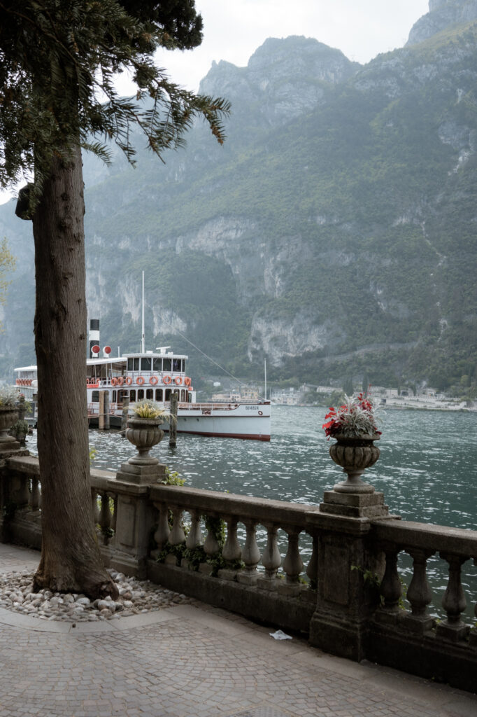 Boat and mountain view in Riva del Garda during a Lake Garda elopement day
