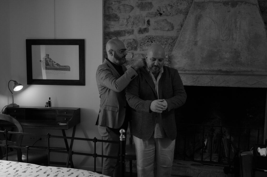 Gay couple getting ready together before their Lake Tenno elopement in Northern Italy