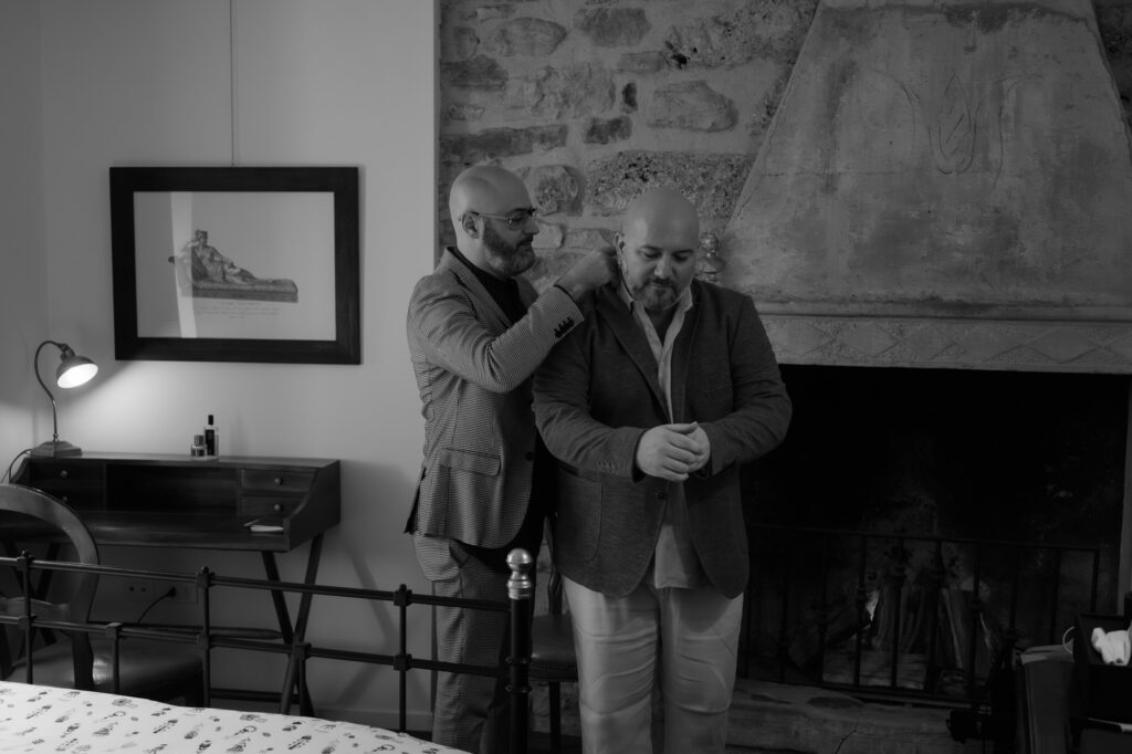 Gay couple getting ready together before their Lake Tenno elopement in Northern Italy