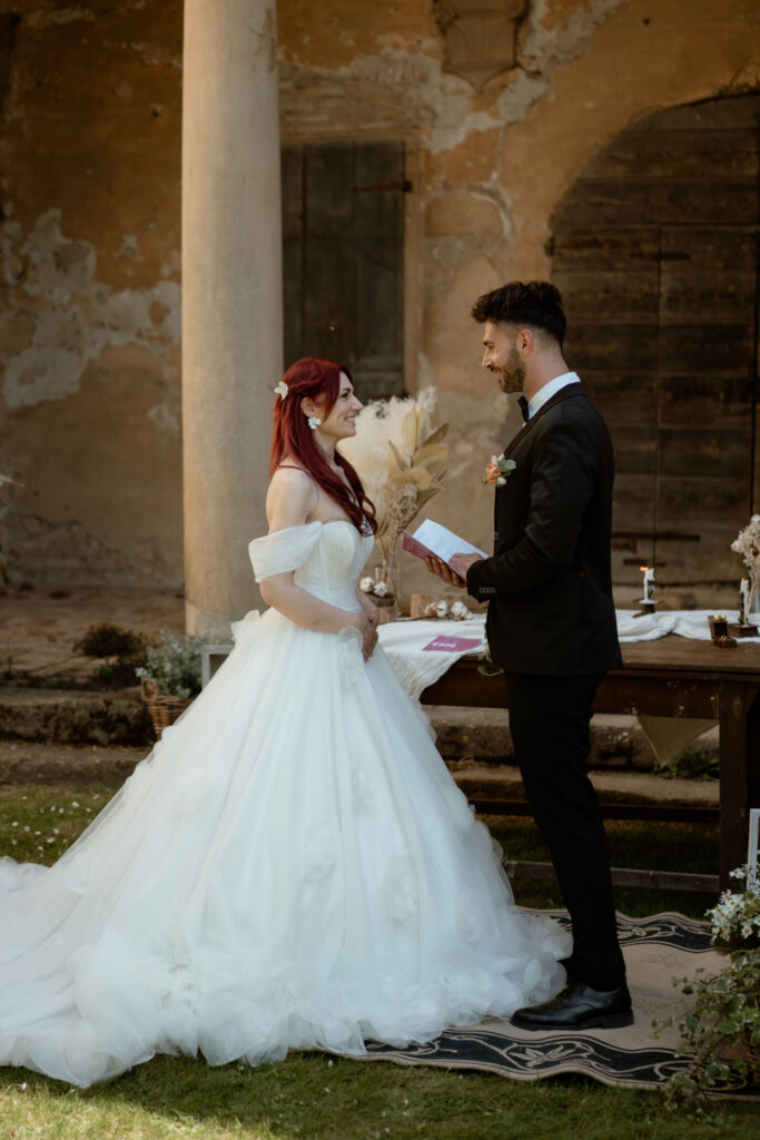 Bride and groom exchanging vows during an intimate wedding at a countryside villa in Italy