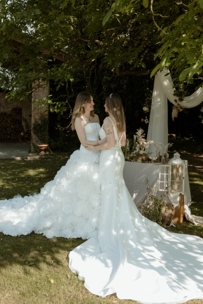 LGBTQ+ couple standing together during an intimate wedding at a countryside villa in Italy