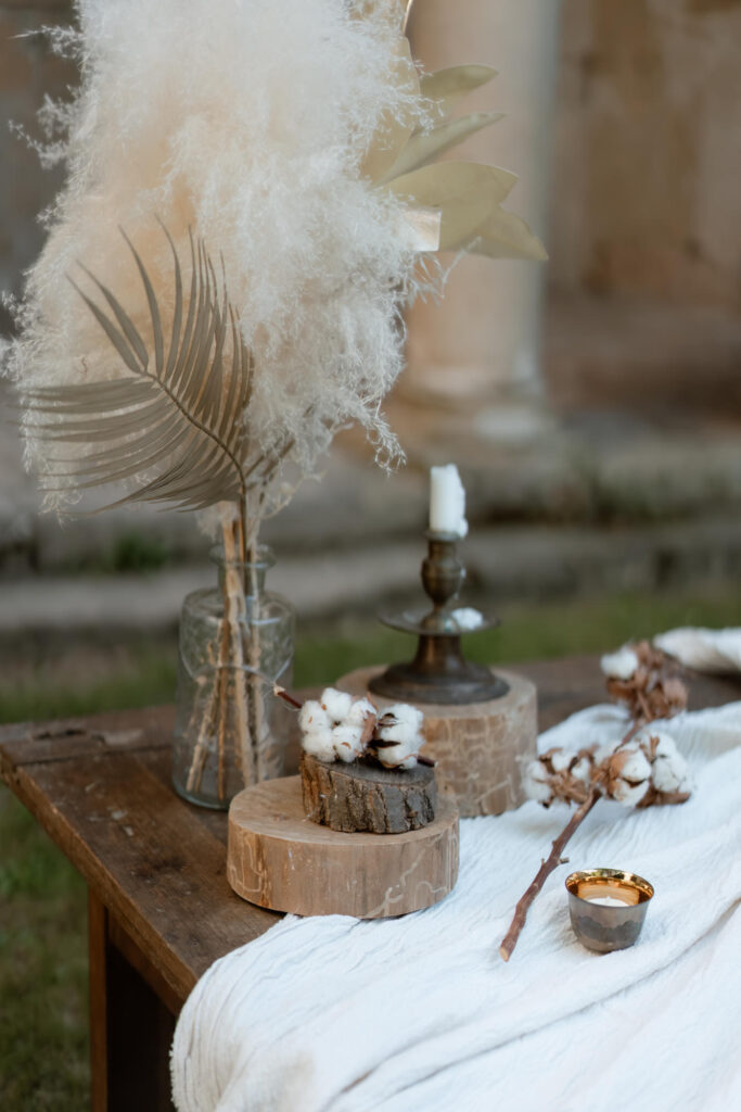 Rustic wedding decor table with dried flowers and candles at a countryside villa in Italy